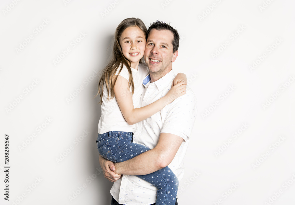 girl with his father, isolated on white wall girl with his father, isolated on white wall