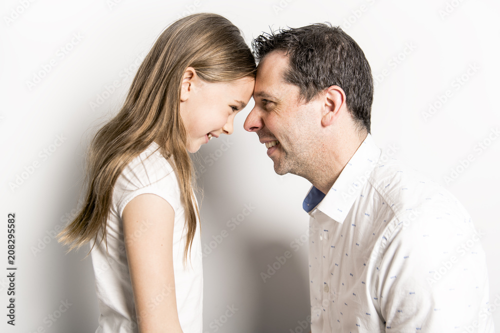 girl with his father, isolated on white wall girl with his father, isolated on white wall