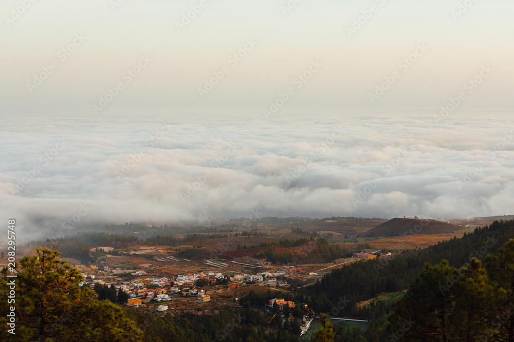 village under the clouds, top view from the mountain