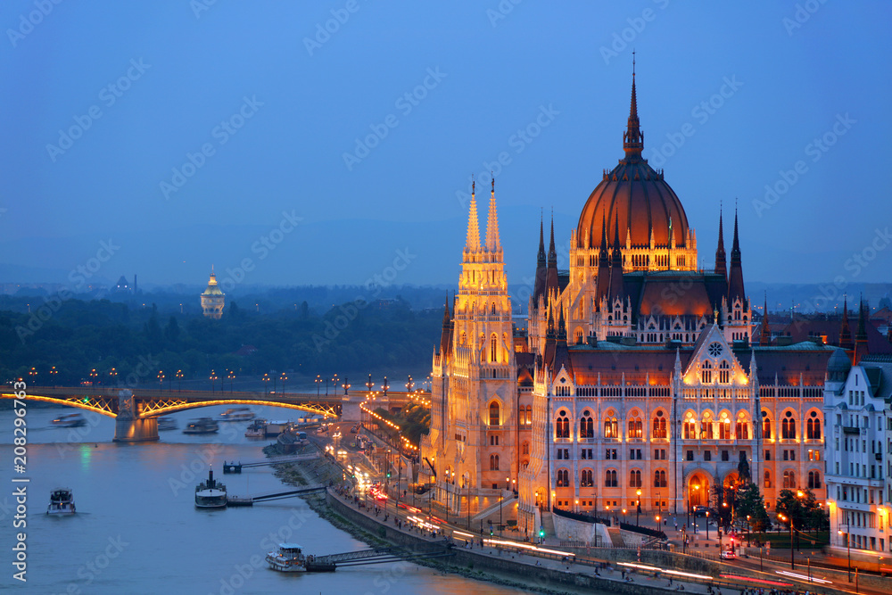 Hungarian Parliament in Budapest by the Danube river in sunset light