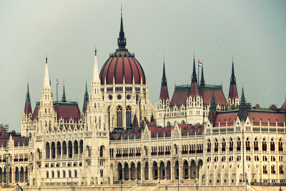 Hungarian Parliament in Budapest by the Danube river in sunset light