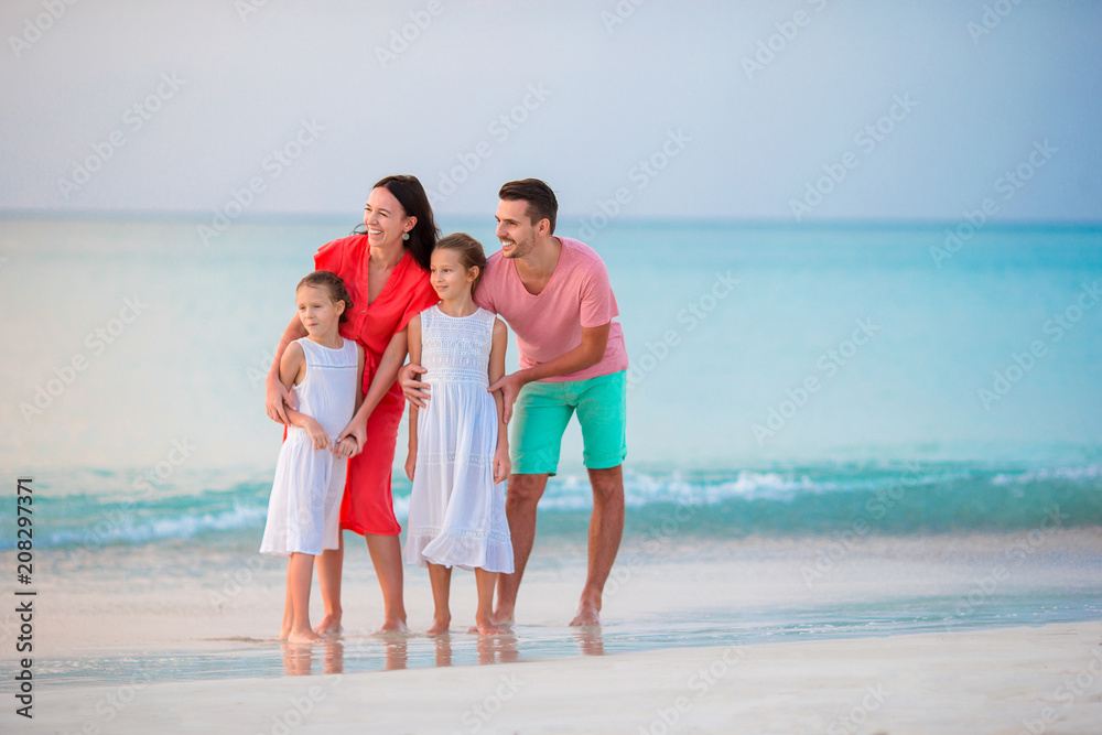 Happy beautiful family on the beach