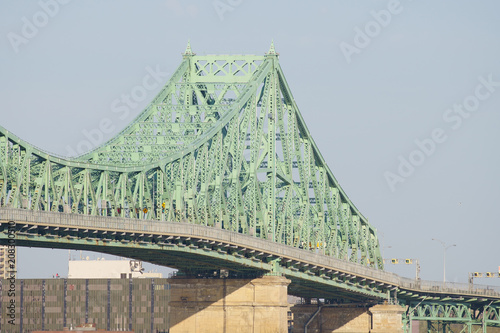 Beautiful Pont Jacques-Cartier bridge on the sunny side in the early morning. Made in steel in the 20's