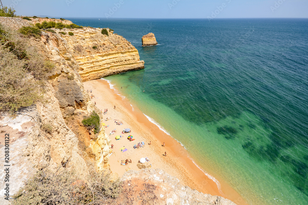 Algarve Portugal: Huge rocks at the cliff beach Praia da Marinha, lovely hidden beach near Lagoa