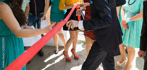 Cutting a red ribbon with scissors, inaugurated ribbon photo