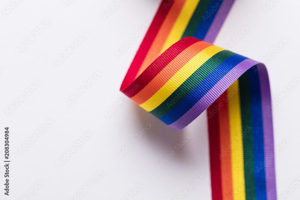 Fototapeta premium Gay pride LGBT rainbow ribbon on white background