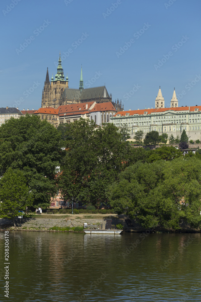 Spring Prague gothic Castle with the Lesser Town above River Vltava in the sunny Day, Czech Republic