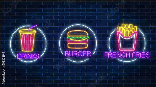 Set of three neon glowing signs of french fries, burger and soda drink in circle frames. Fastfood light billboard symbol