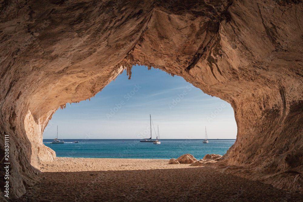 Inside a cave at Cala Luna beach - obrazy, fototapety, plakaty 