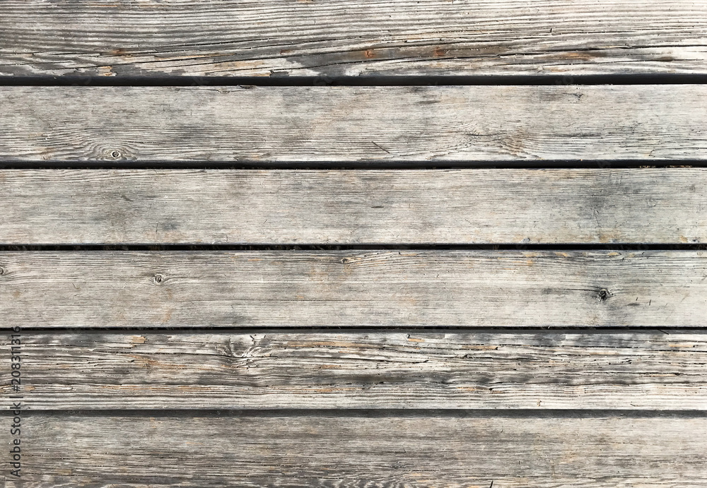 Wooden background with grey horizontal planks. Old and rough wood texture Wooden background with grey horizontal planks. Old and rough wood texture