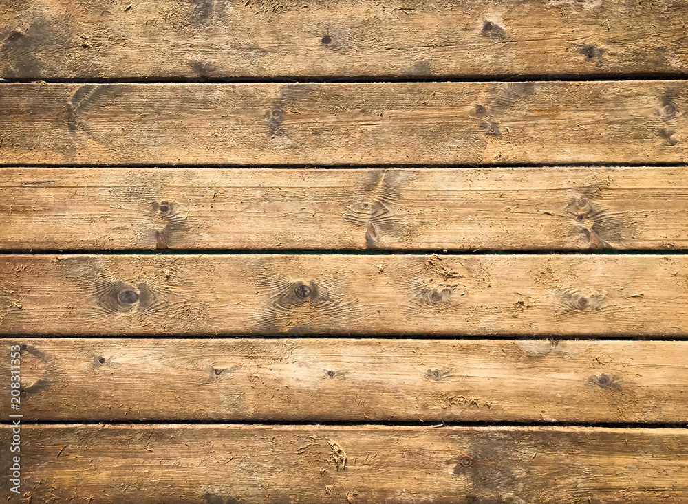 Naklejka premium Wooden background with brown horizontal planks. Old and rough wood texture