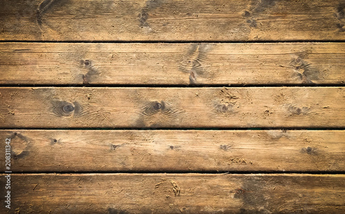 Wooden background with brown horizontal planks. Old and rough wood texture
