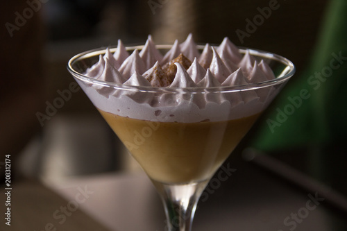 Delicious suspiro limeño on glass. Traditional Peruvian sweet dessert. Restaurant delicatessen concept