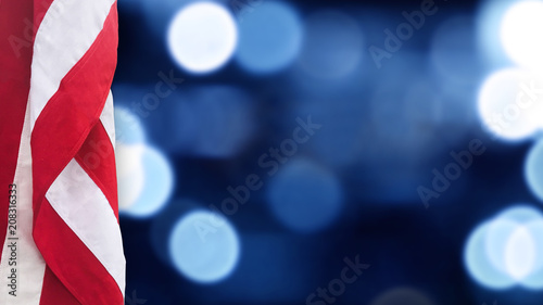 American Flag With Blue Bokeh Lights Background for United States Holidays photo