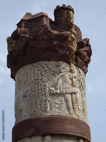 Carving of a Rapunzel scene on a fountain.