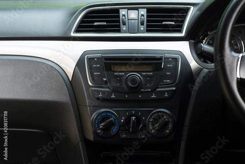 Car radio and air system,Button on dashboard in dirty car panel © gballgiggs