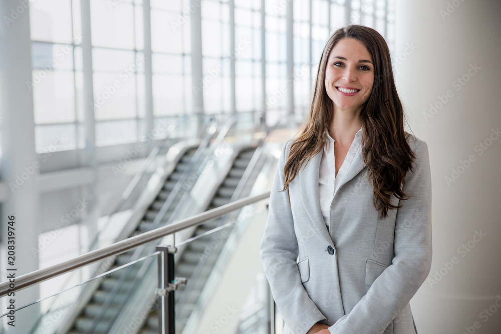 Friendly likable portrait of an executive business woman manager, advisor, agent, representative at office Friendly likable portrait of an executive business woman manager, advisor, agent, representative at office