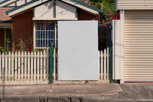 Blank real estate sign outside an suburban residential property