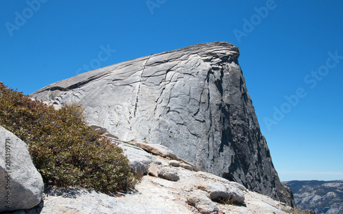 Cables with climbers on Half Dome as seen from the Sub Dome in Yosemite National Park in California United States