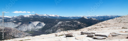 View of the High Sierra Nevada mountains from the top of Half Dome in Yosemite National Park in California United States