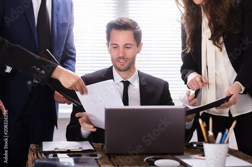 Young Businessman Looking At Document