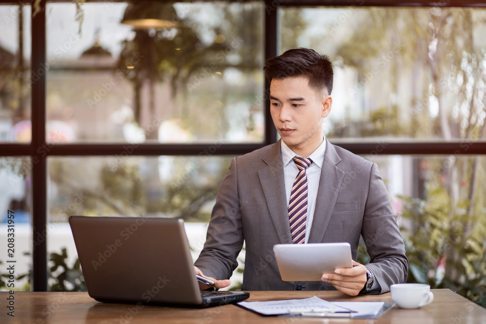 Business man working at office with laptop and documents on his desk, consultant lawyer concept Business man working at office with laptop and documents on his desk, consultant lawyer concept