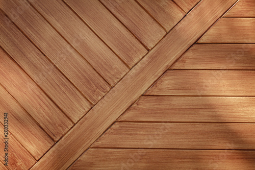 Brown wood texture background. The wooden planks are stacked diagonal.