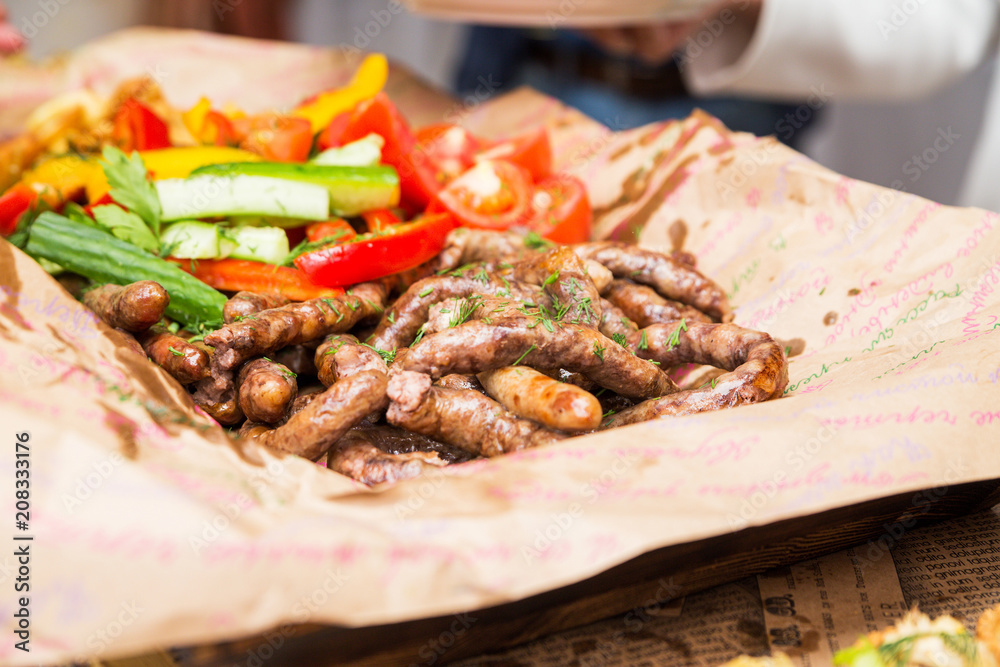 snack from fried sausages and fresh vegetables snack from fried sausages and fresh vegetables