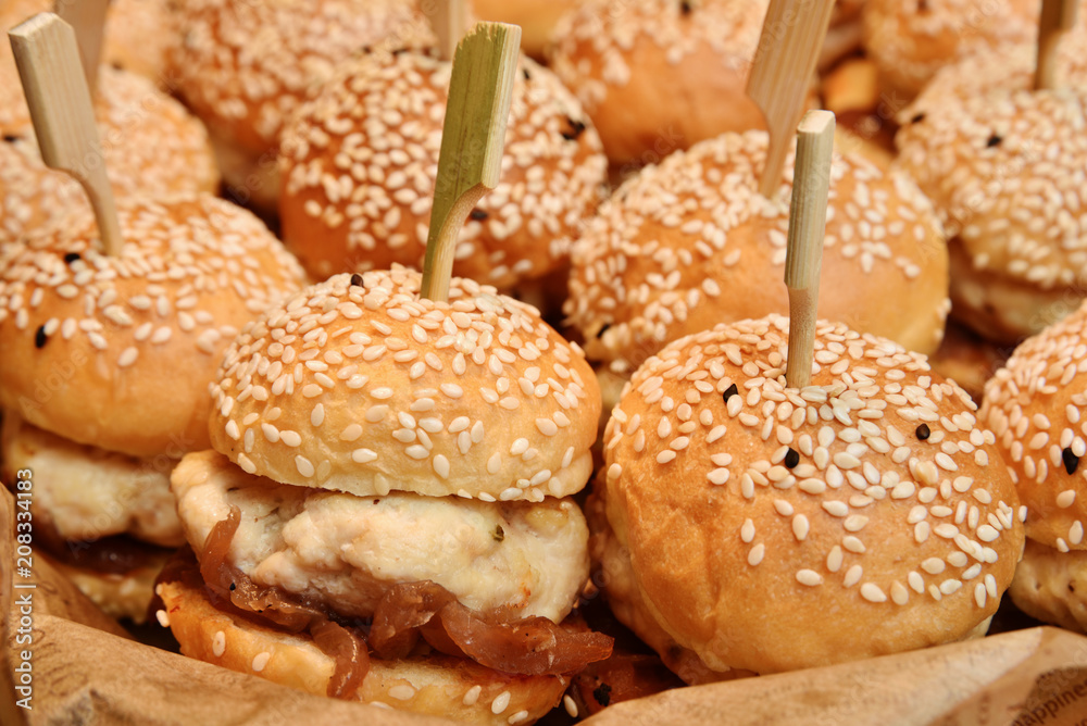Mini chicken burgers in buffet corner Mini chicken burgers in buffet corner