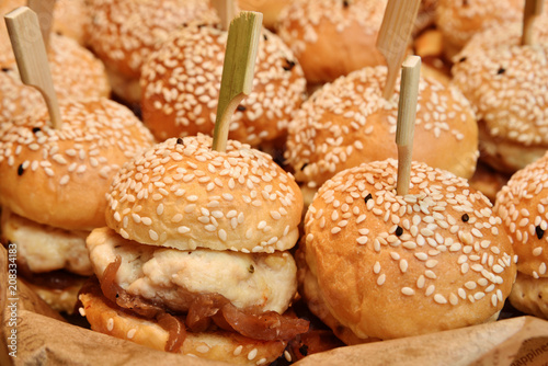 Mini chicken burgers in buffet corner 