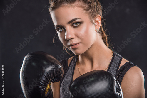 Beautiful sportswoman in boxing gloves © Siarhei Kulikou