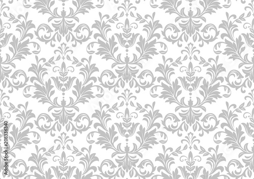 Wallpaper in the style of Baroque. A seamless vector background. White and grey floral ornament. Graphic pattern for fabric, wallpaper, packaging. Ornate Damask flower ornament.