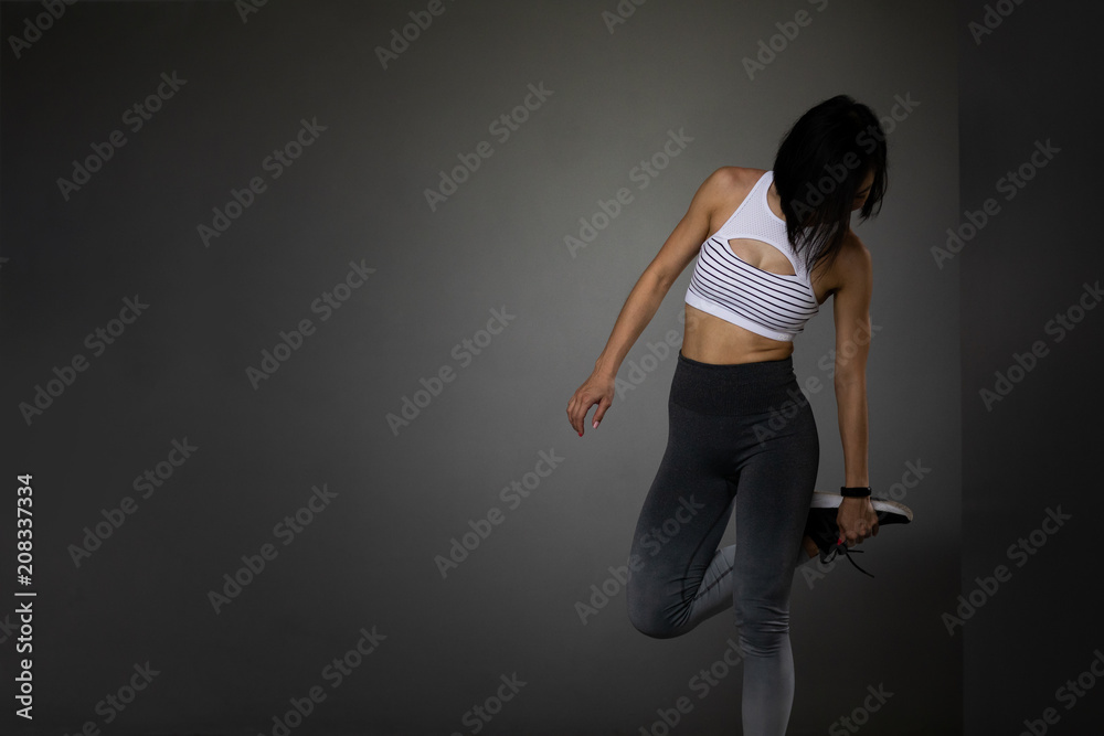 Young woman streching, posing in yoga attire Young woman streching, posing in yoga attire