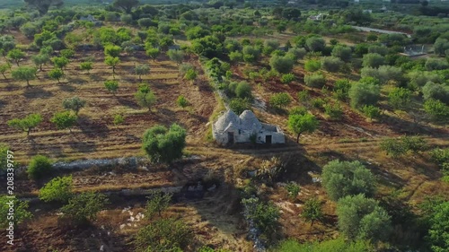 Trullo trulli old whitr House in the field in Italy Drone 4k flight