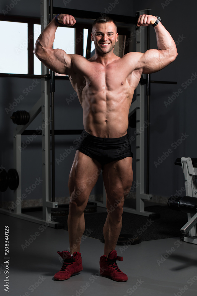 Muscular Men Is Hitting Rear Double Bicep Pose Muscular Men Is Hitting Rear Double Bicep Pose