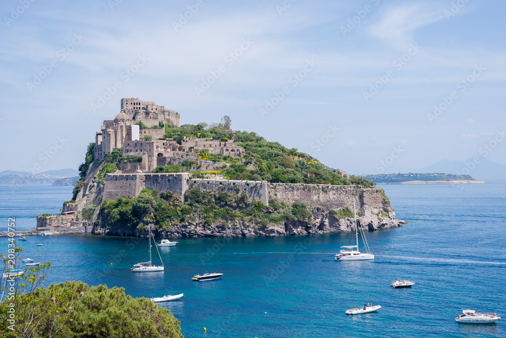 Ancient castle on the island in the blue sea Ischia Italy