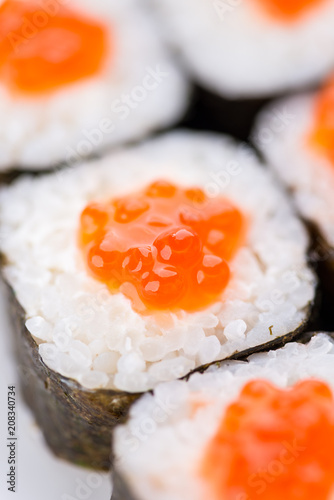 Sushi set and composition at white background. Japanese food restaurant, sushi maki gunkan roll plate or platter set. photo