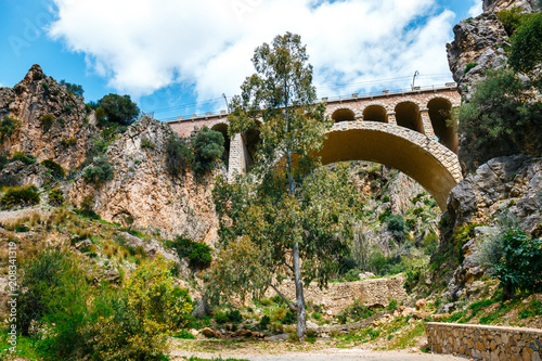 stone railway bridge in the village of el chorro at the end of trail of Caminito Del Rey