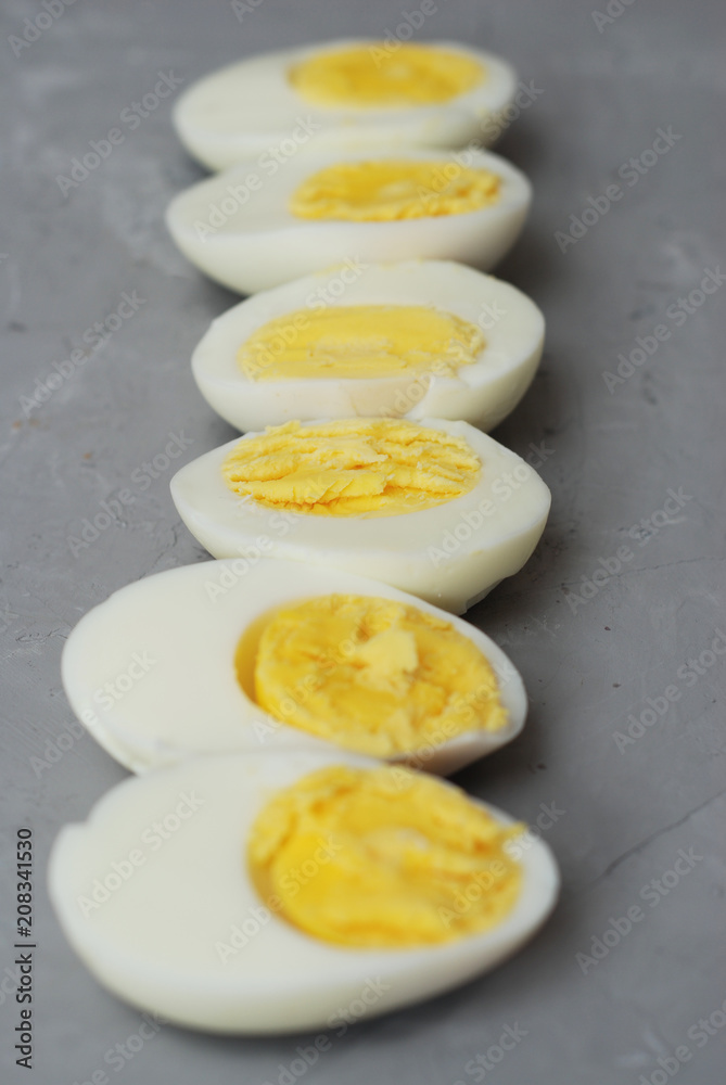 Hard Half Boiled Eggs, Sliced in Halves Food Ingredient Preparation Gray Textured Background Hard Half Boiled Eggs, Sliced in Halves Food Ingredient Preparation Gray Textured Background