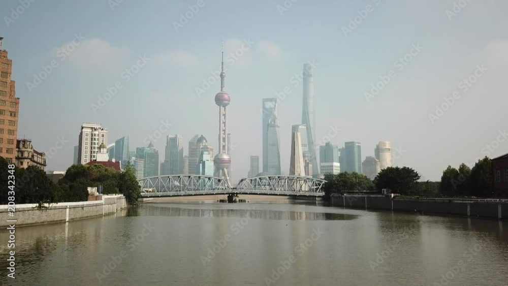 Shanghai,aerial shot of the River, Towers, buildings in a fog, haze, cloudy day, at noon, China Shanghai,aerial shot of the River, Towers, buildings in a fog, haze, cloudy day, at noon, China