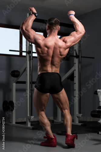 Bodybuilder Performing Rear Double Biceps Pose