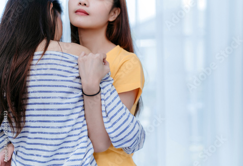 Same sex asian lesbian couple lover embrace and kiss erotic scene in the  bedroom happiness feeling, LGBT sexuality female hug living together at  home. foto de Stock | Adobe Stock
