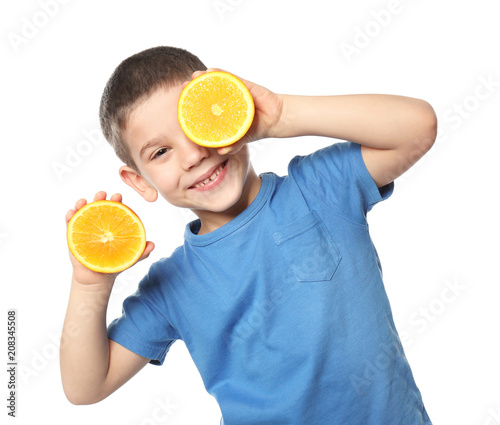 Cute little boy with citrus...