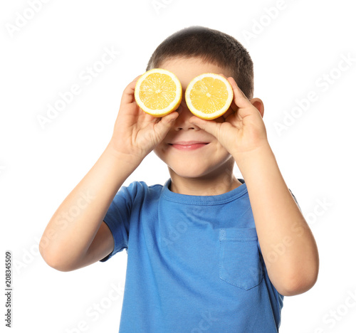 Cute little boy with citrus...