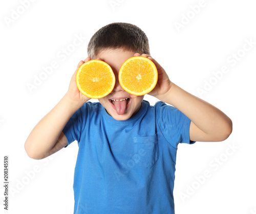 Cute little boy with citrus...