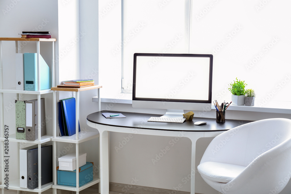 Comfortable home workplace with computer on table Comfortable home workplace with computer on table
