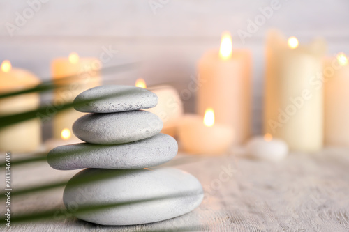 Stack of spa stones on wooden table