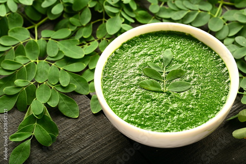Vegan healthy cream soup made of moringa oleifera leaves. photo