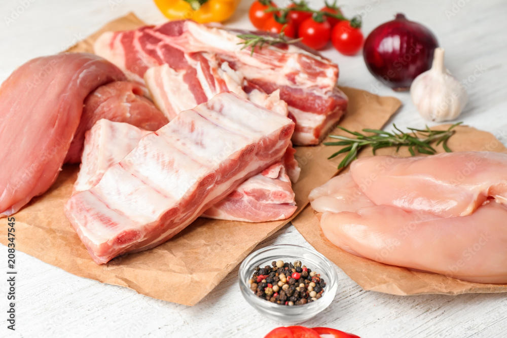 Different kinds of raw meat products on table