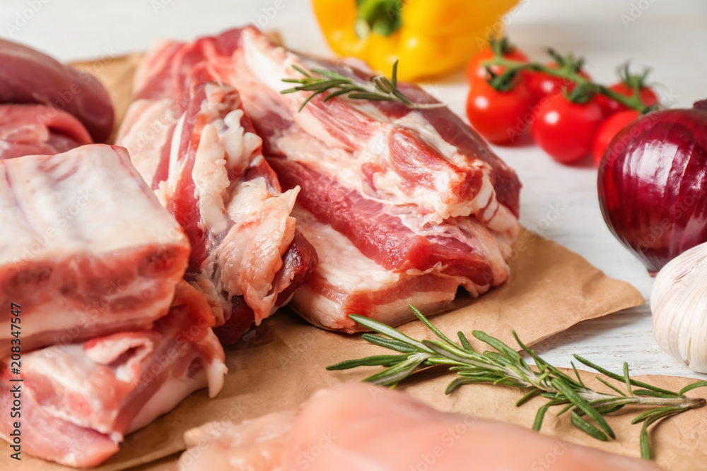 Different kinds of raw meat products on table